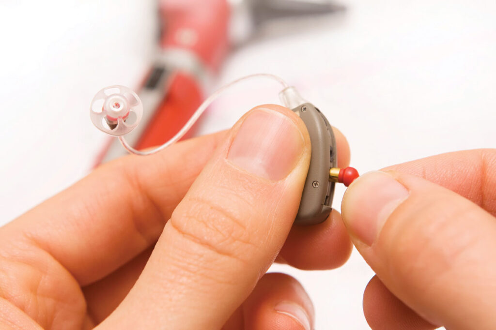 Close up of a hearing aid being repaired